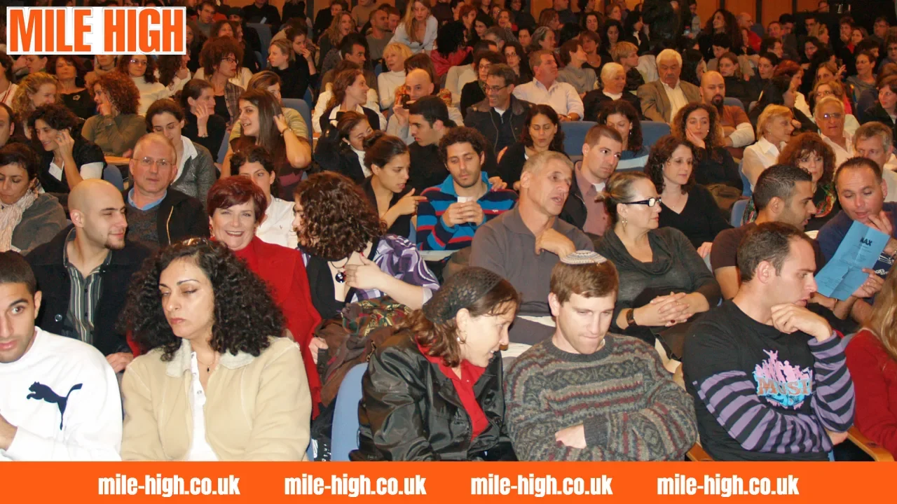 Audience gathered at a live event reflecting shared viewing experiences and public reactions